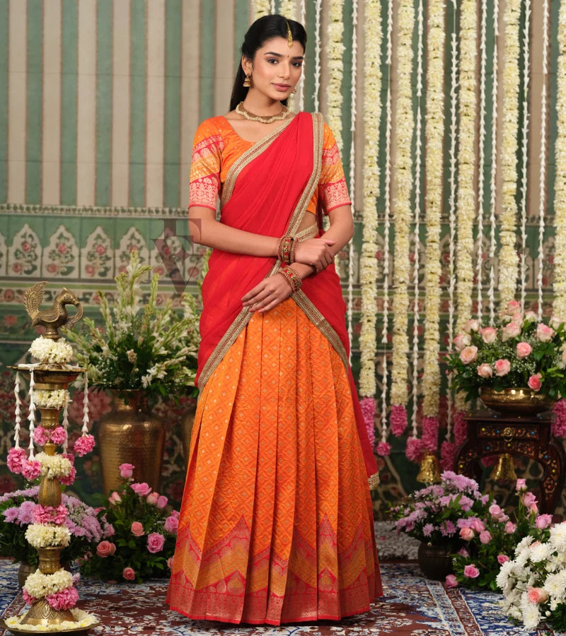 vibrant orange Banarasi silk half saree with rich woven detailing