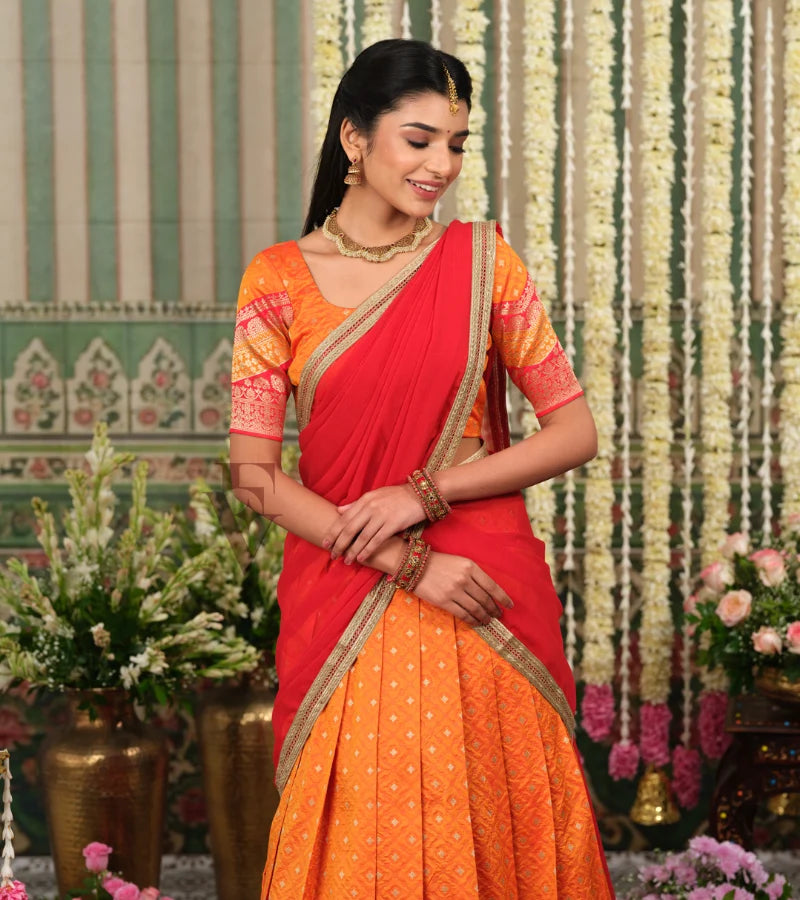 vibrant orange Banarasi silk half saree with rich woven detailing