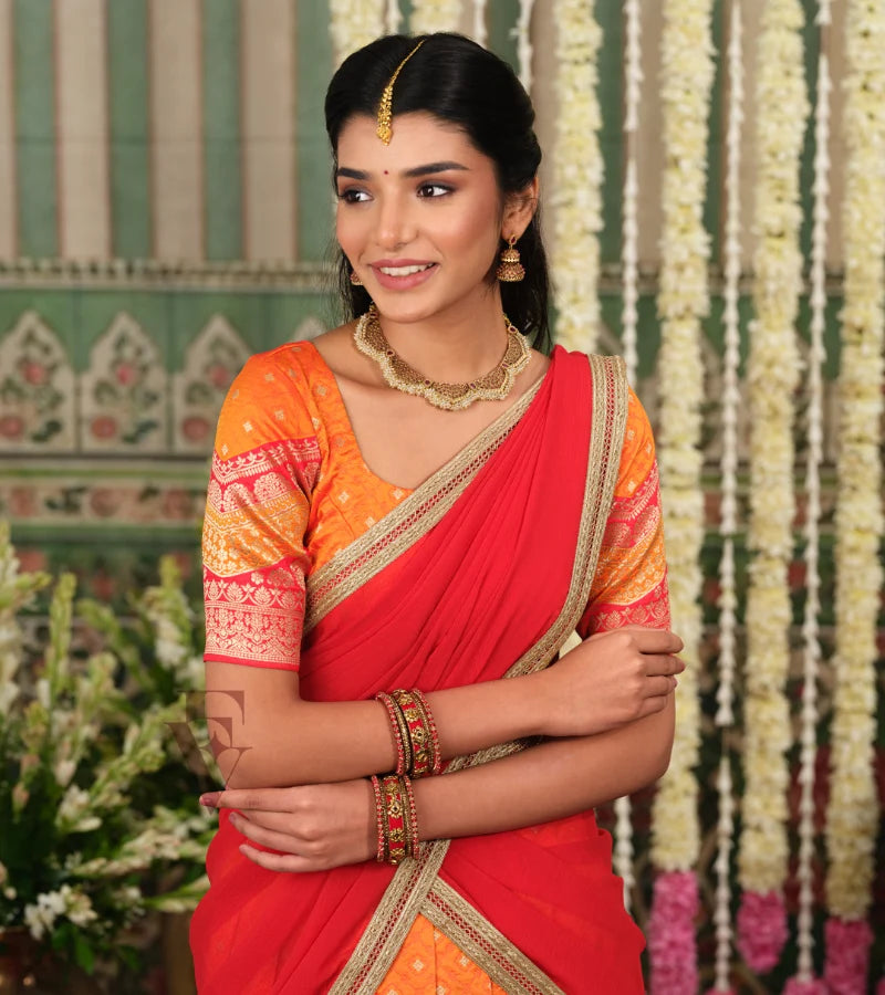 vibrant orange Banarasi silk half saree with rich woven detailing