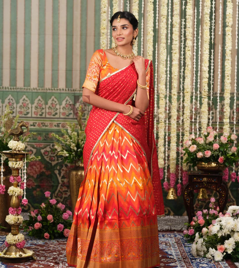 Red and orange Banarasi silk half saree with intricate woven detailing