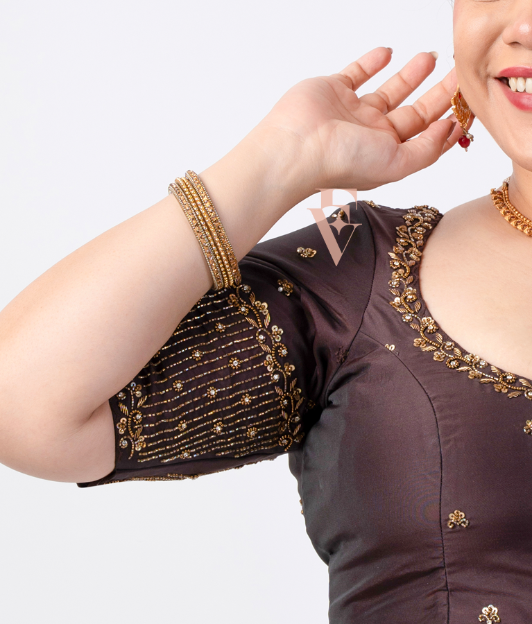 A brown silk cotton blouse designed