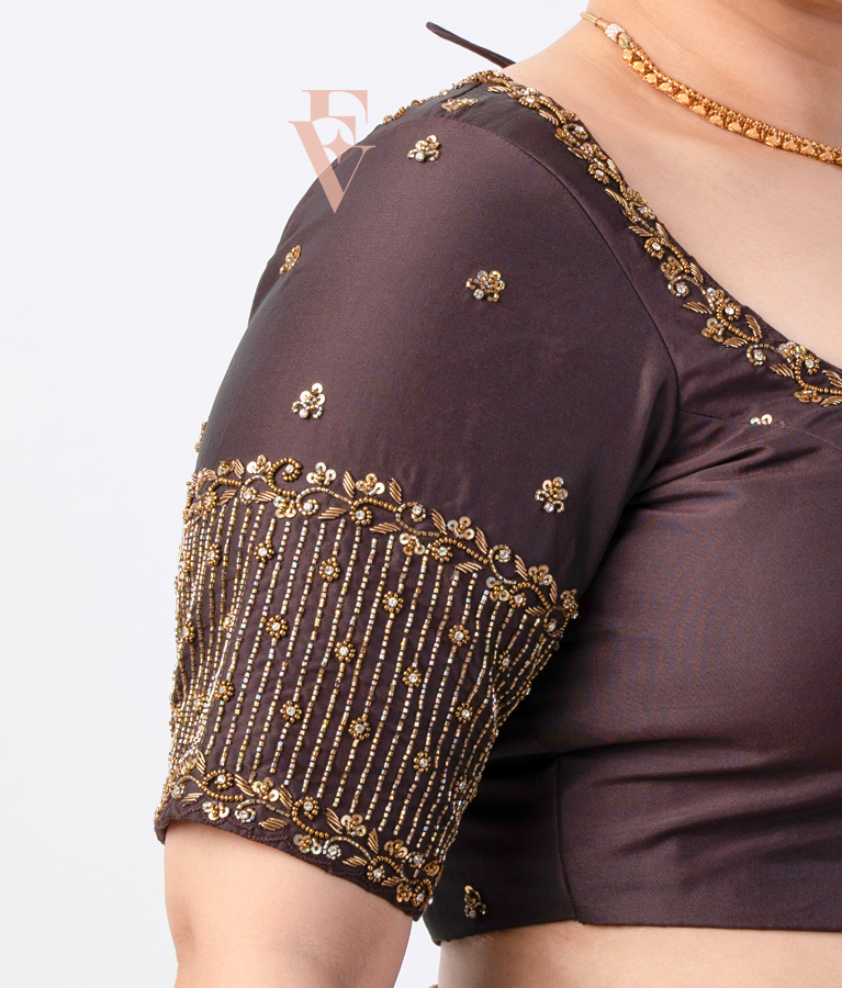 A brown silk cotton blouse designed