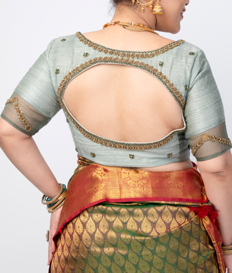 A light green raw silk blouse