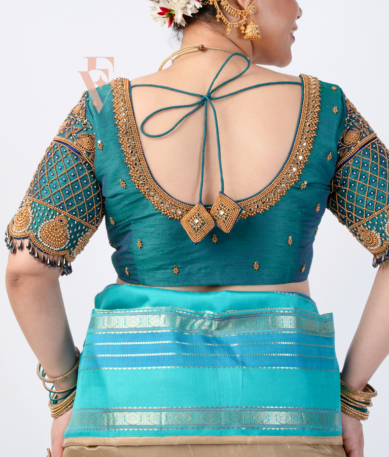 A peacock green raw silk blouse