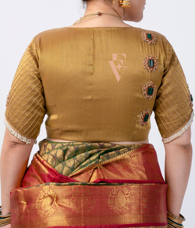 A gold tissue silk blouse