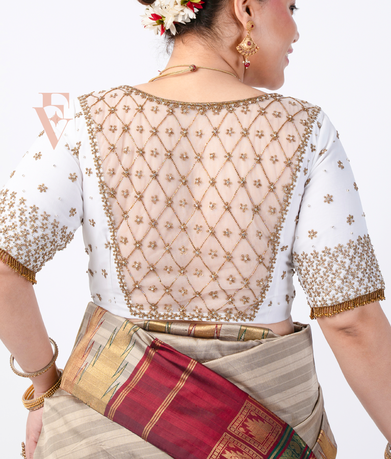 A half white georgette with net blouse