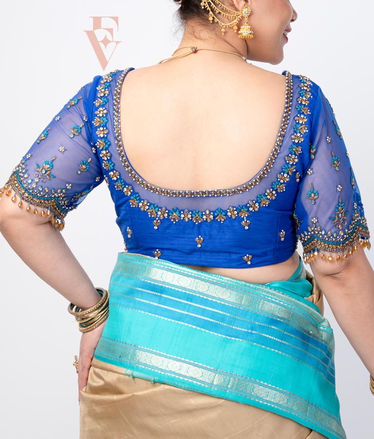 A blue raw silk with net blouse designed