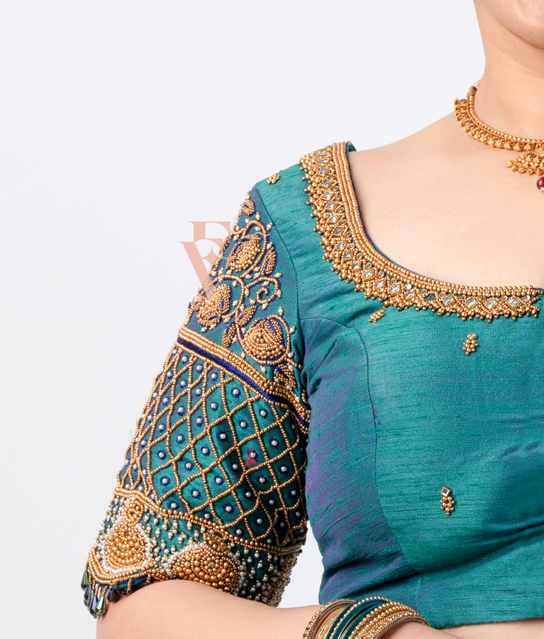 A peacock green raw silk blouse