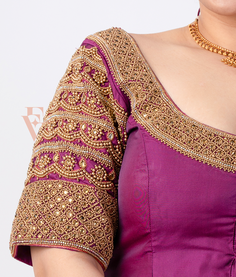 A magenta silk cotton blouse designed