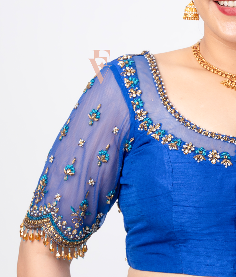 A blue raw silk with net blouse designed
