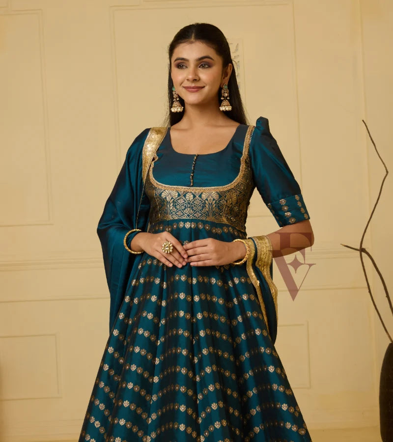 A rich peacock blue Banarasi silk gown