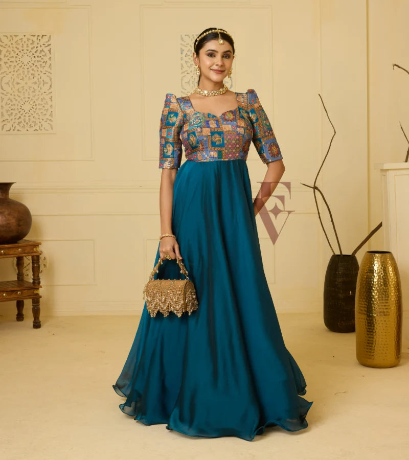 A peacock blue georgette silk gown
