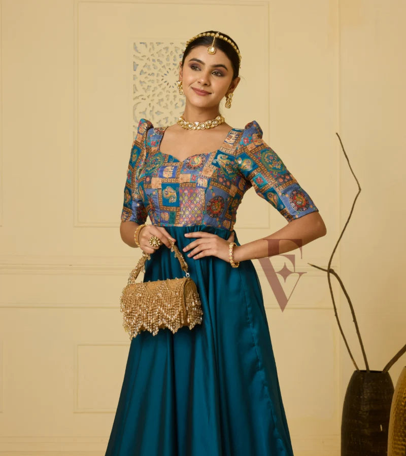 A peacock blue georgette silk gown