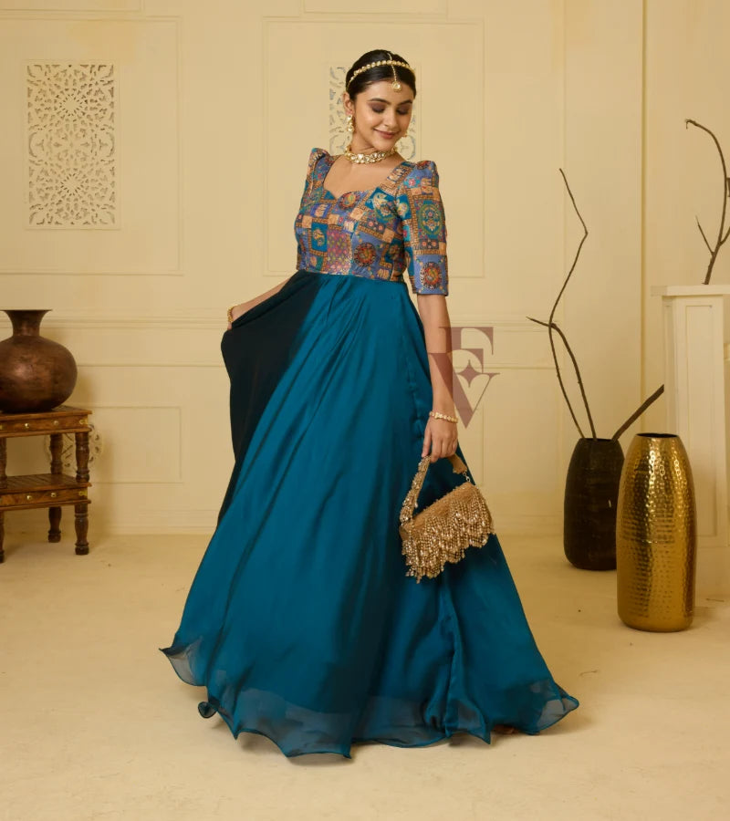 A peacock blue georgette silk gown
