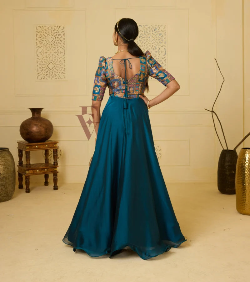 A peacock blue georgette silk gown