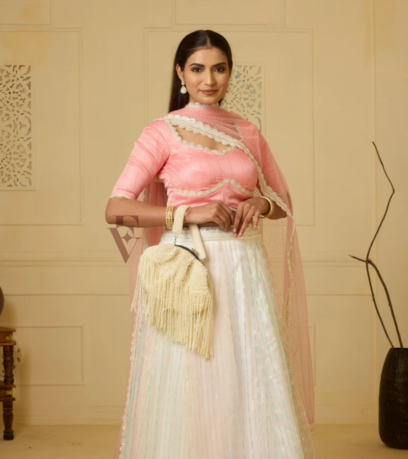 A stunning off-white and multi-color lehenga
