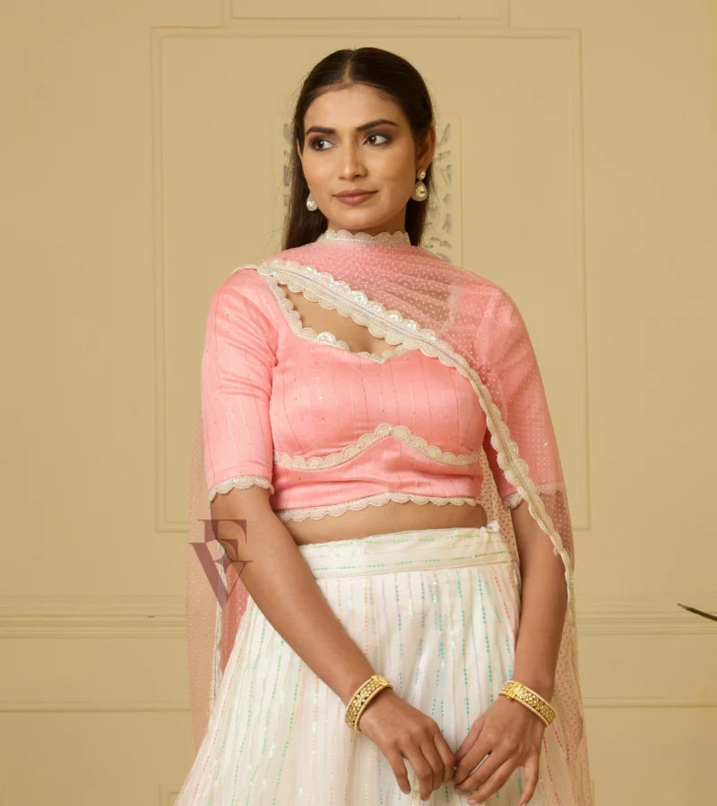 A stunning off-white and multi-color lehenga