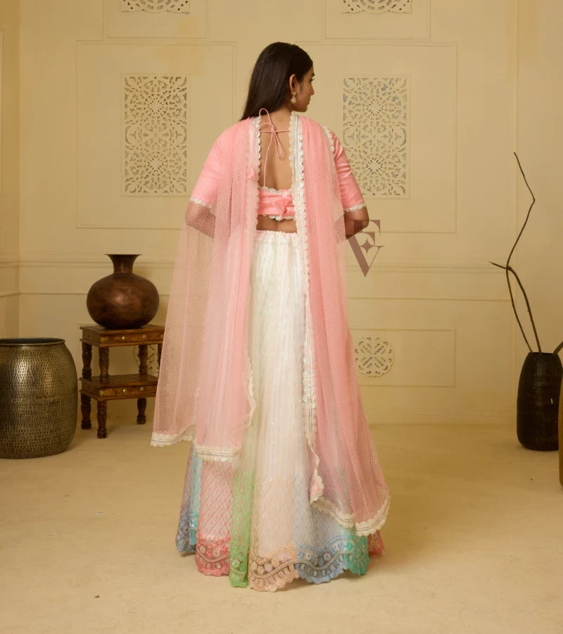 A stunning off-white and multi-color lehenga