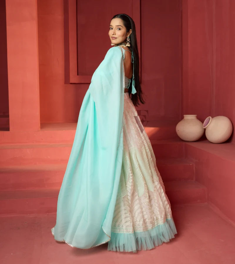 This off-white and turquoise lehenga