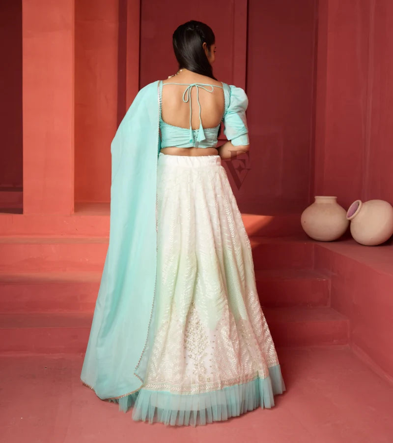 This off-white and turquoise lehenga
