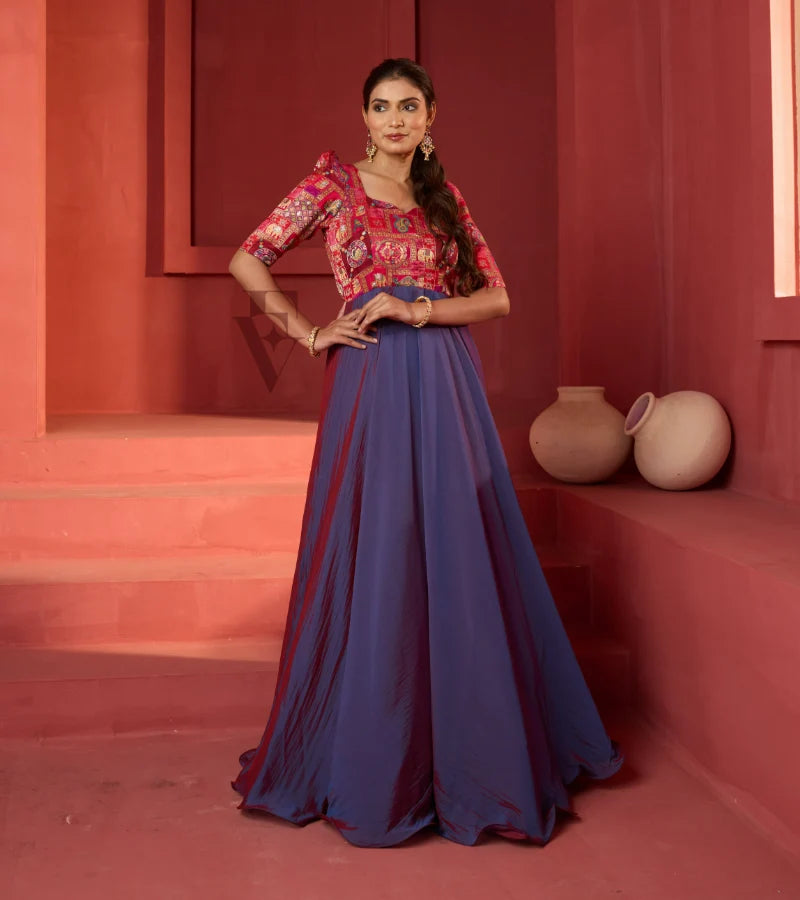 A pinkish violet flared umbrella gown