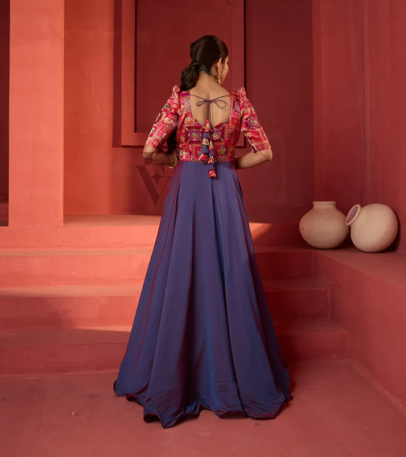 A pinkish violet flared umbrella gown