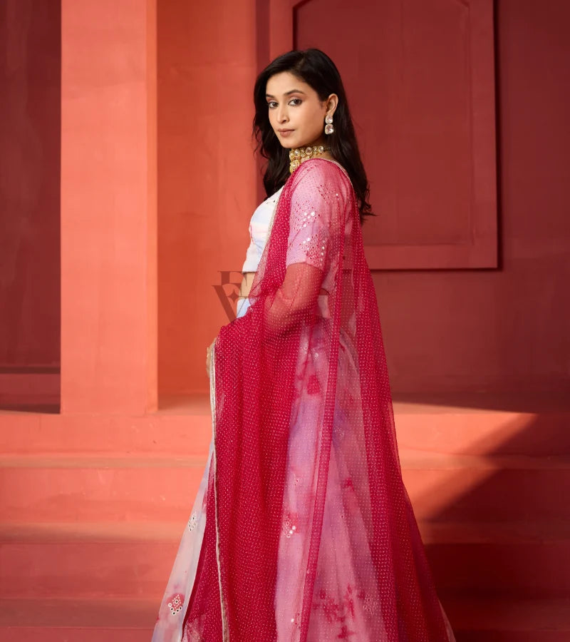 This off-white and maroon lehenga