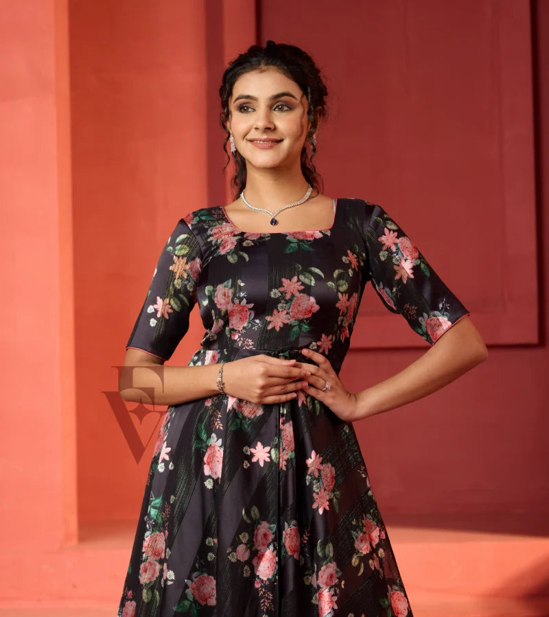 A flowy deep onion pink georgette plaza paired with a black printed georgette satin long coat