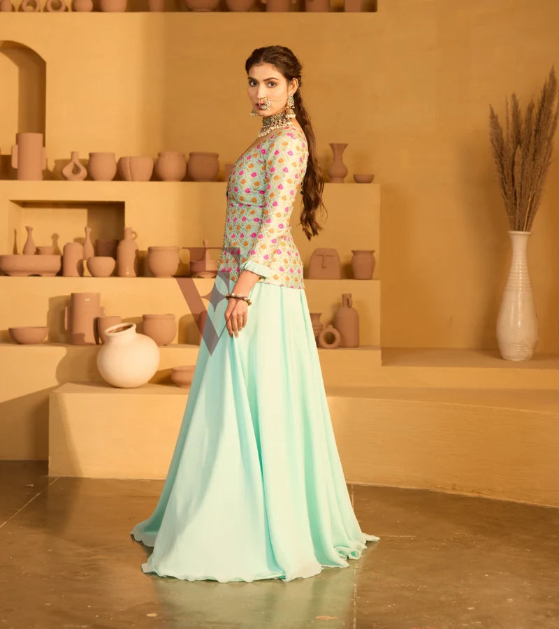 A graceful aqua blue outfit featuring a flowing georgette skirt