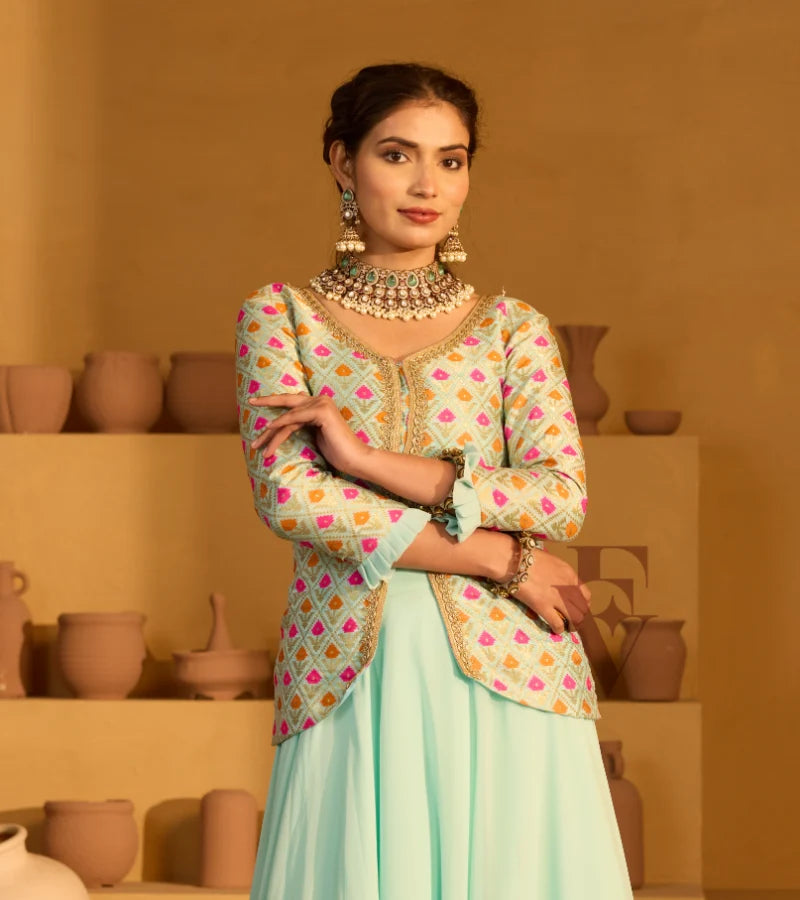 A graceful aqua blue outfit featuring a flowing georgette skirt