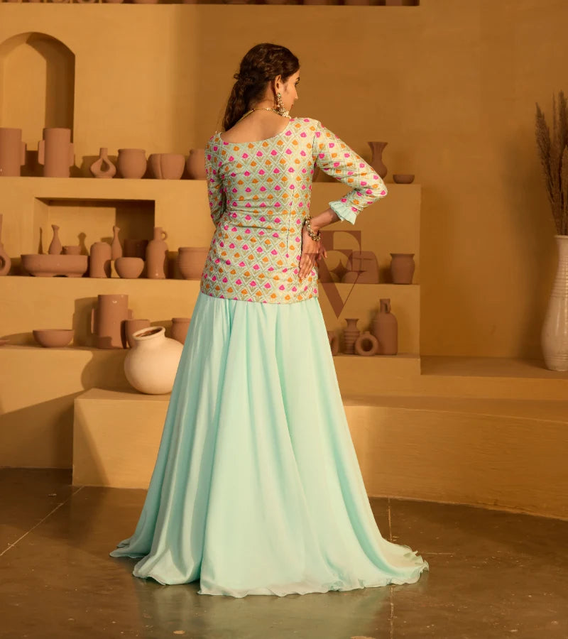 A graceful aqua blue outfit featuring a flowing georgette skirt