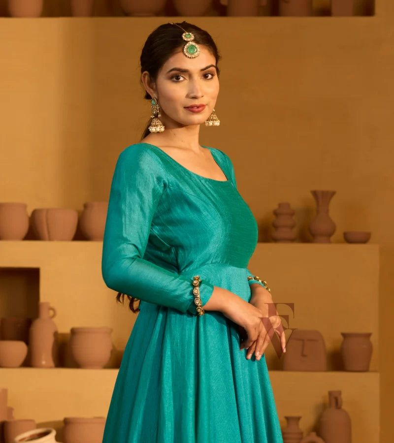 A peacock green flared gown