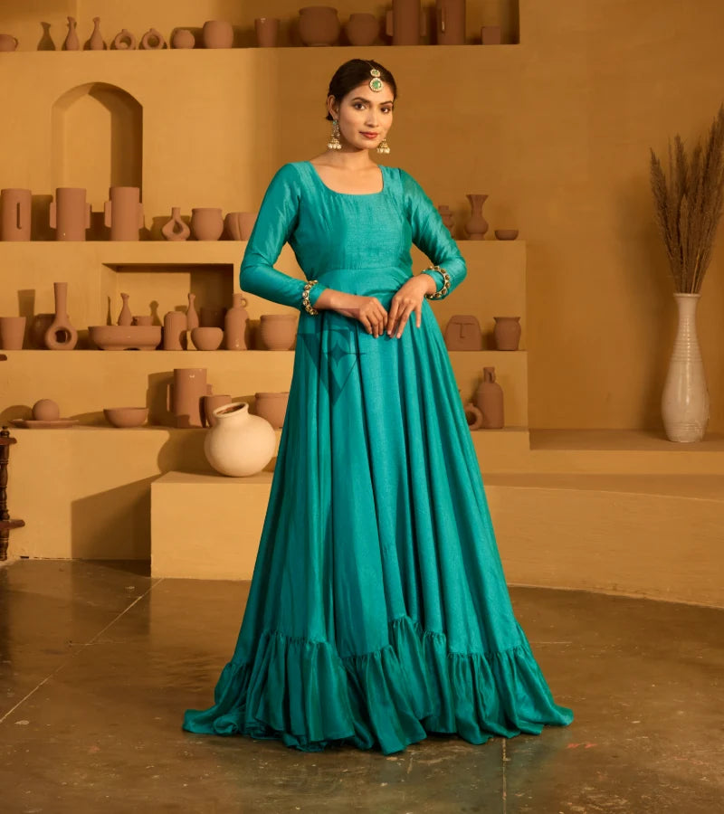 A peacock green flared gown