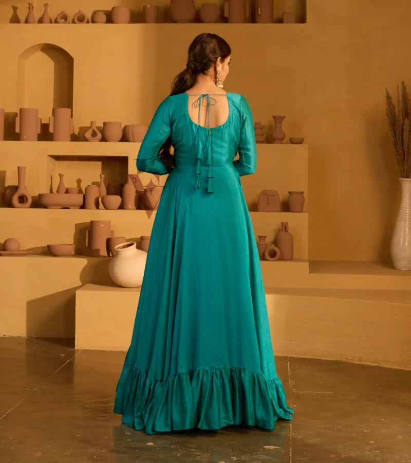 A peacock green flared gown