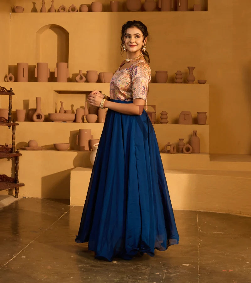 A peacock blue georgette silk gown