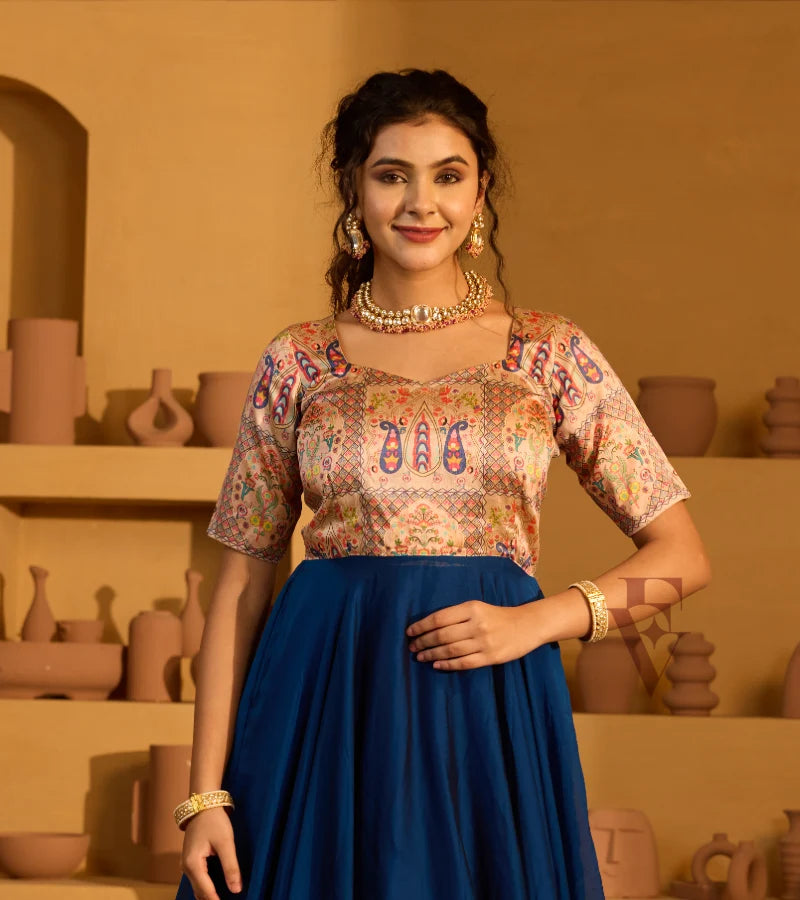 A peacock blue georgette silk gown