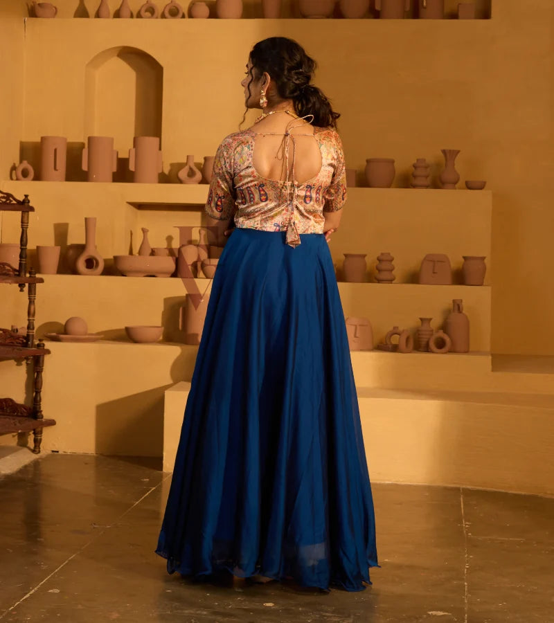 A peacock blue georgette silk gown
