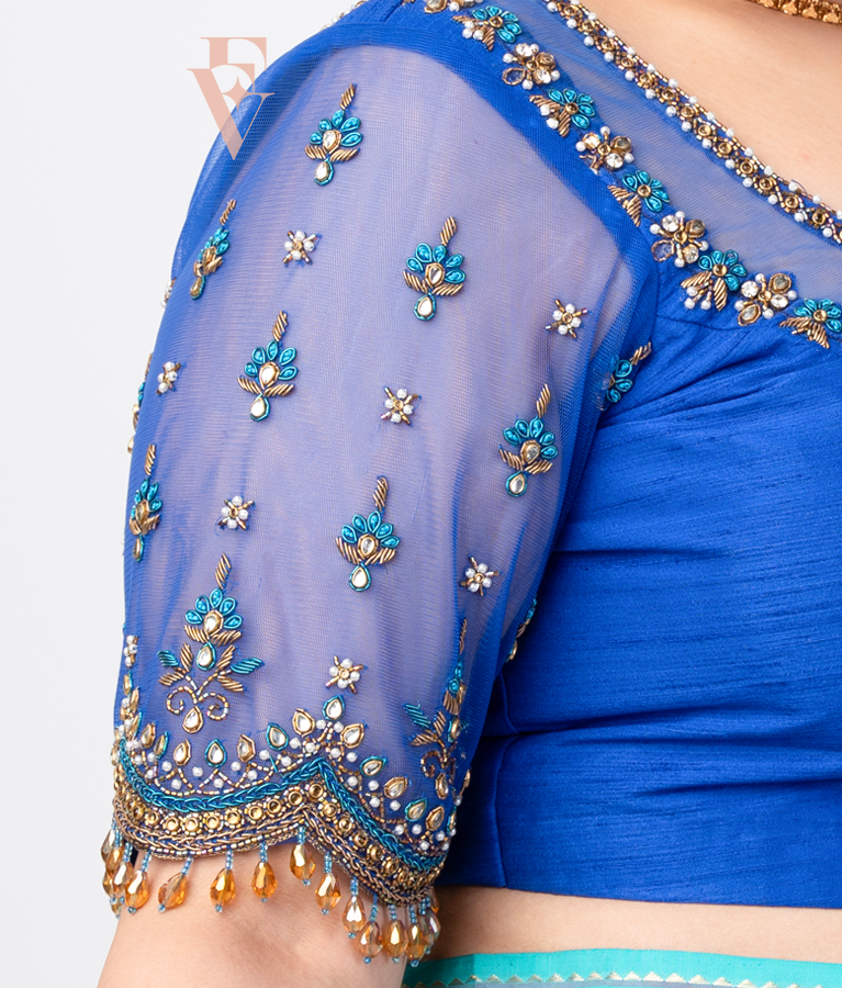 A blue raw silk with net blouse designed