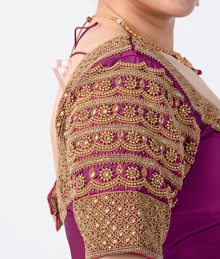 A magenta silk cotton blouse designed