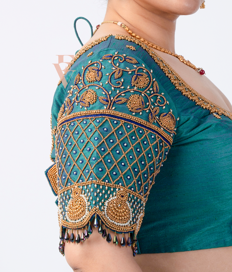 A peacock green raw silk blouse
